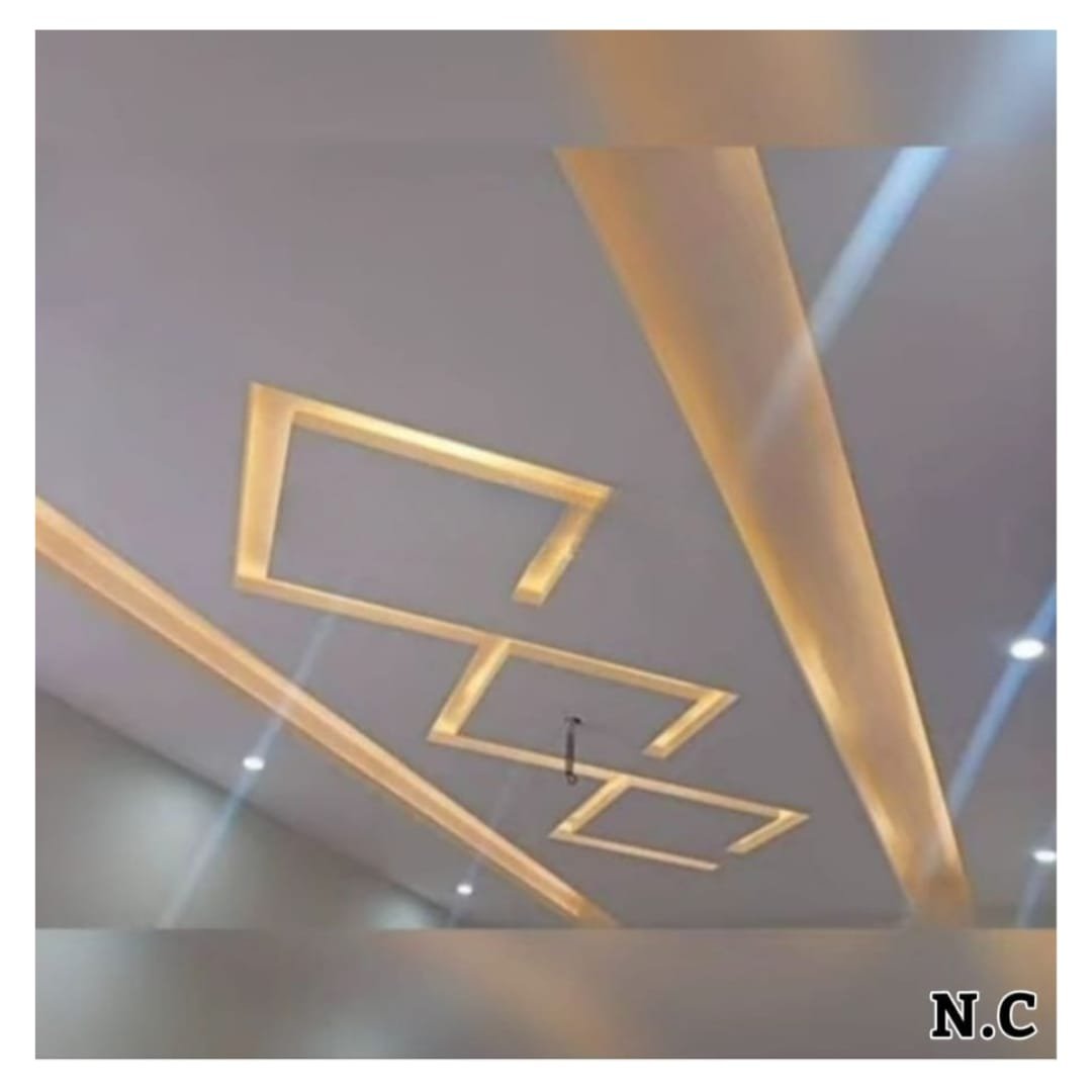 Modern false ceiling portfolio reference with geometric wooden elements and cove lighting