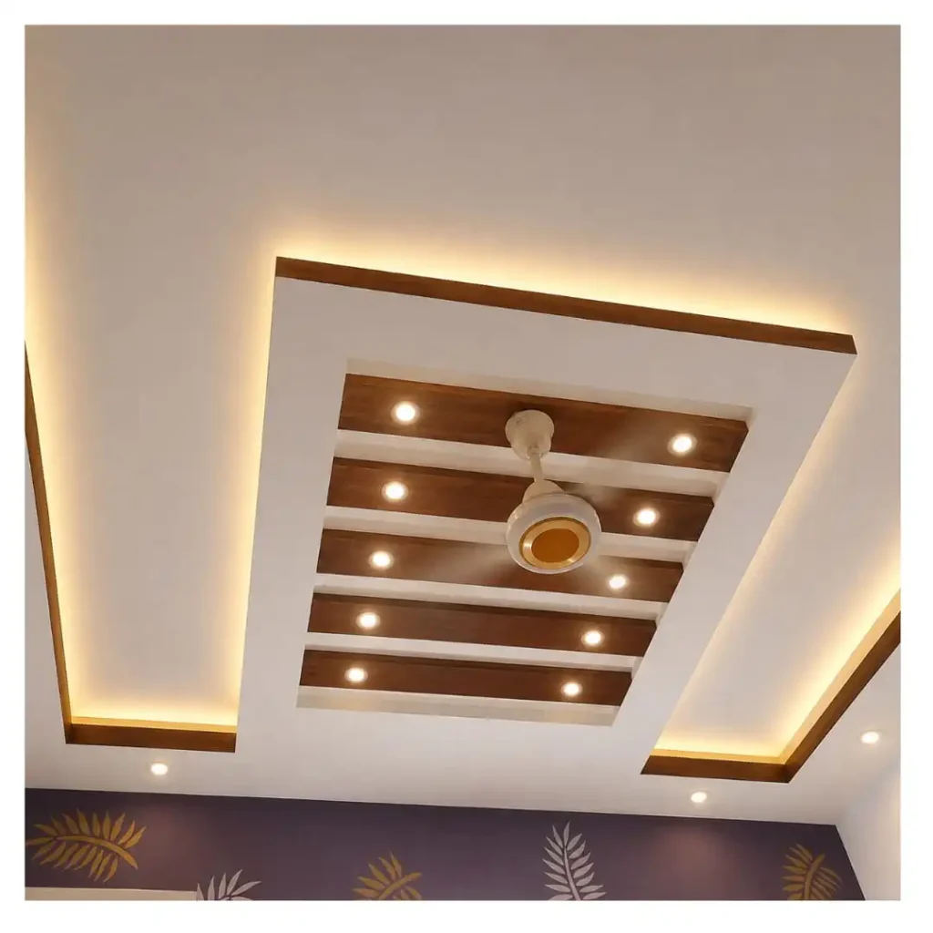 Installed gypsum false ceiling with warm LED cove lighting and decorative center panel with spot lights